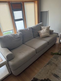 3 seat, one-piece light gray sofa