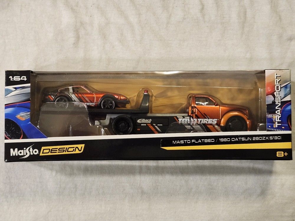 2020 MAISTO PREMIUM 1:64 SCALE. TRANSPORT. 1980 DATSUN 280ZX S130. WITH FLATBED TOW TRUCK.