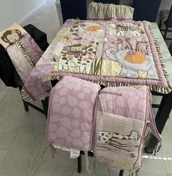 Crib bedding with matching bed skirt, curtain runner and diaper holder