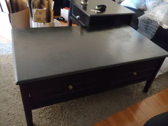 Living spaces coffee table and two end tables.