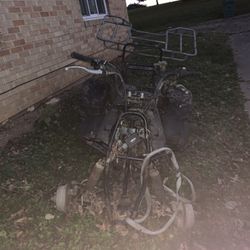 4 Wheeler. Needs Work. It Just Needs Ignition And Battery.  Camouflage Body Covers Included! Pick Up Only