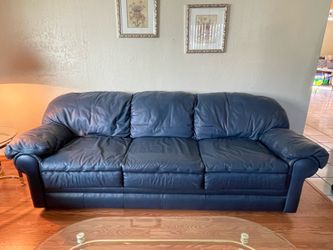 Blue leather couch and love seat