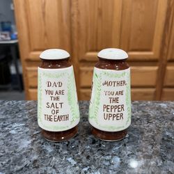 Vintage Mid Century 1950’s Dad and Mother Pair of Salt and Pepper Shakers.  Size approximately 3 1/2 inches tall.  Preowned.  Has been on display in a