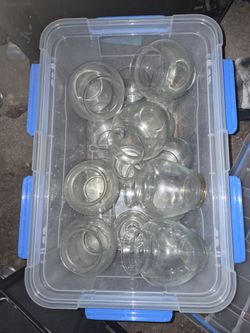 Cleaning out and selling a large bin of assorted glass flower vases. Includes a variety of shapes and sizes, perfect for weddings, events, florists, c