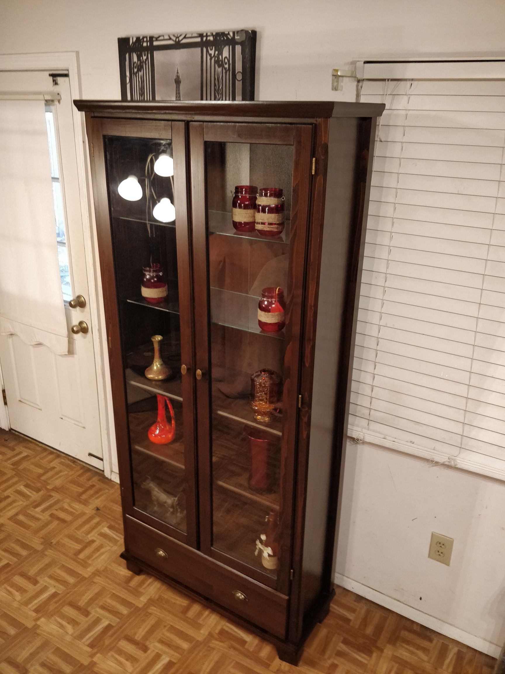 Like new wooden cabinet with wood& glass shelves,one big drawer in great condition, let