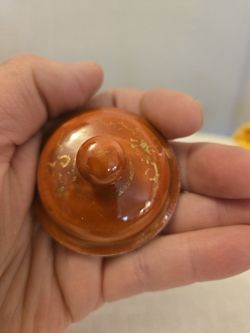 Replacement lid, orange color with gold design. Measurement 2 1/4" round diameter, 1" tall. No chips or Cracks. Very good condition.