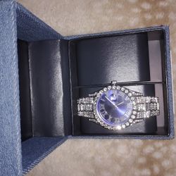 Moisonx And Diamond Watch With Blue Interior Considered A Light Blue.