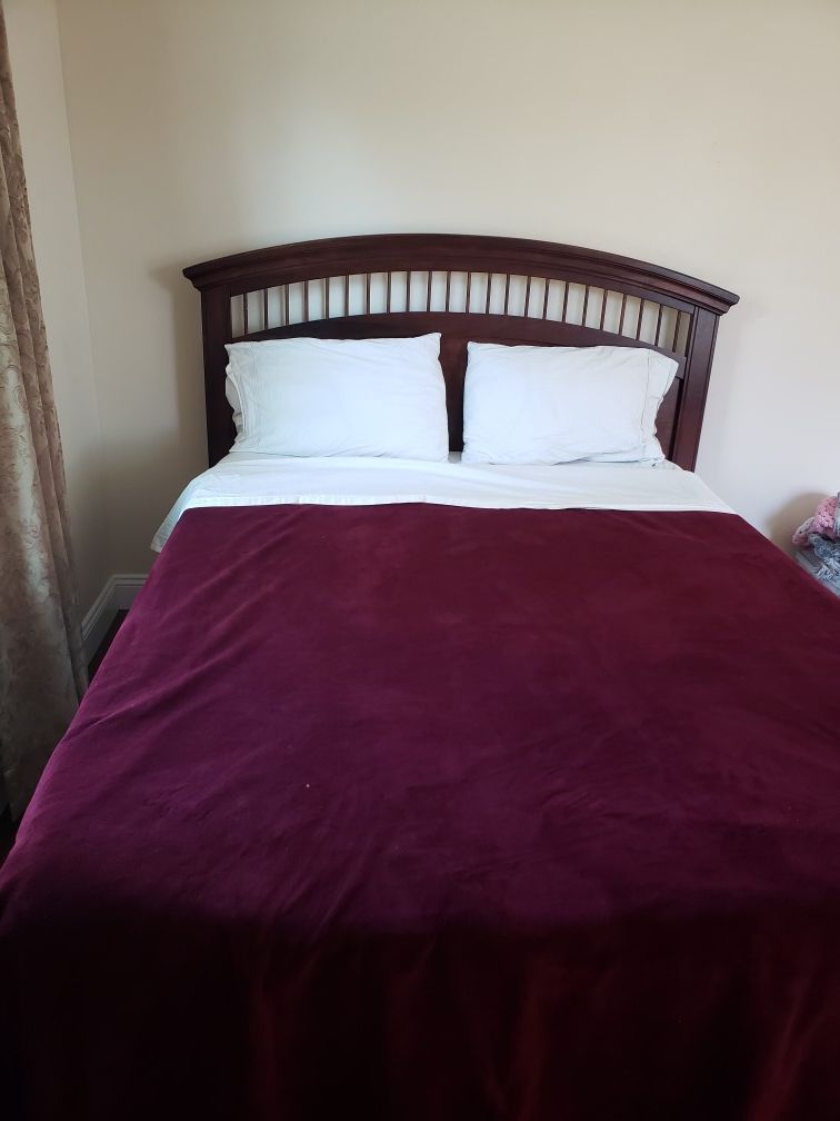 Queen bed frame with box spring and foam mattress