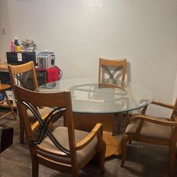 Round glass dining table and chairs