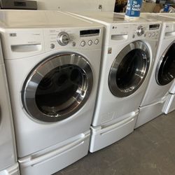 LG washer and electric dryer on a pedestal we finance