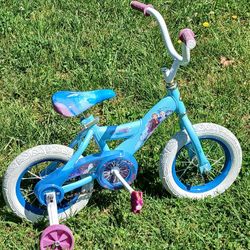 HUFFY LIL GIRLS 12" BEAUTIFUL BIKE WITH TRAINING WHEELS.