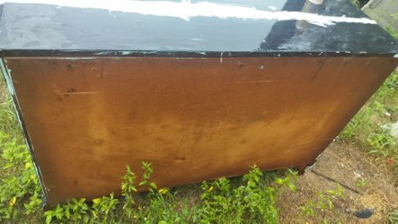 A dresser for 25 bucks as is what you see is what you get I glued the top where it was cracked on the top and one leg needs to be repaired and needs t