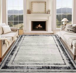 5’x7’ washable grey area rug (New)