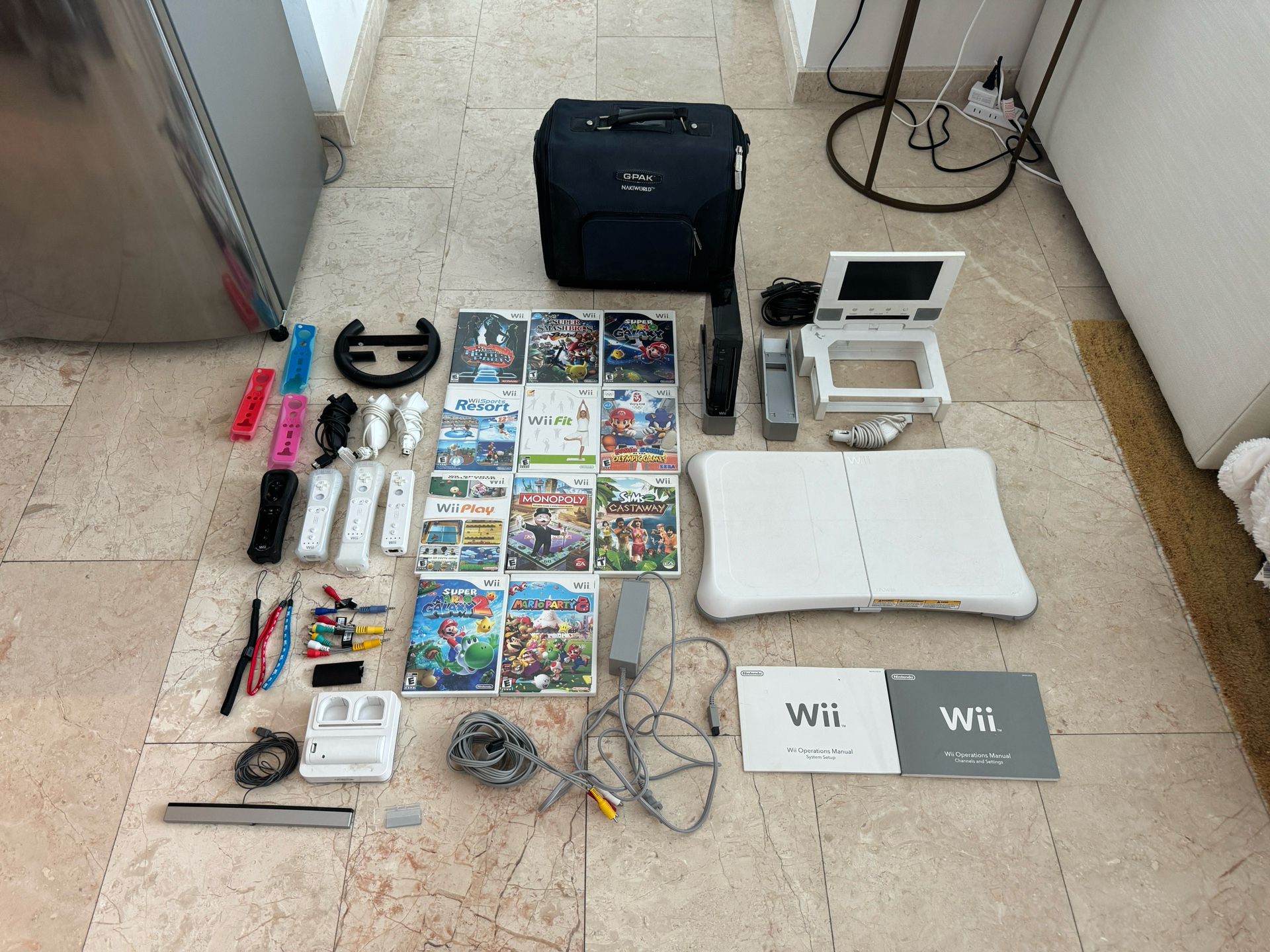 Nintendo Wii Bundle With 11 Games, Wii Fit, Travel Screen, 4 Remotes, 3 Nunchuks, And Rechargeable Remotes