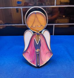 Vintage stained glass angel girl with prayer book