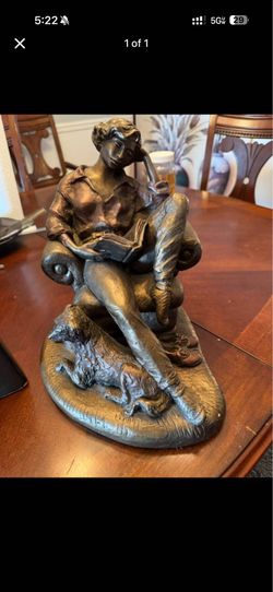 vintage "Woman Sitting on a Couch Reading a Book" sculpture signed by artist Alice Heath and produce
