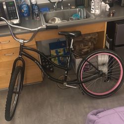 Bike -(all black one ..pink colored lined wheel .)