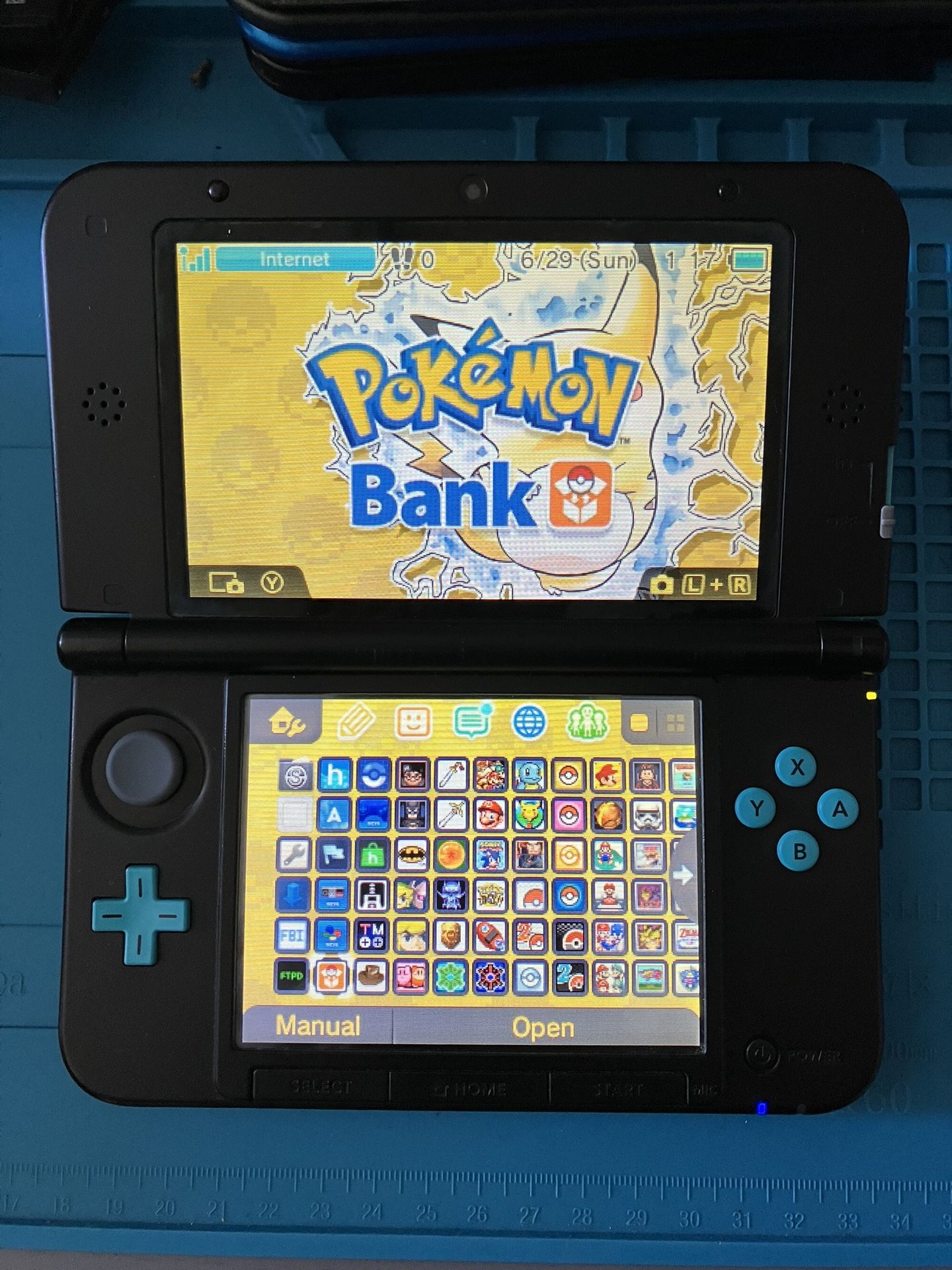 Nintendo Turquoise 3DS XL With Pokemon Bank, Pokemon DS, Stylus, 64 GB SD Card