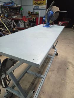 Miter saw with rolling table