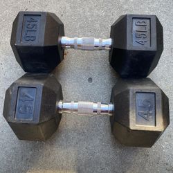 Set pair of 45-pound each rubber-coated hexagonal dumbbells. 