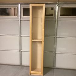 IKEA storage cabinet with a glass door 79 inches tall 16 inches wide and 10 inches deep    (excellent condition)