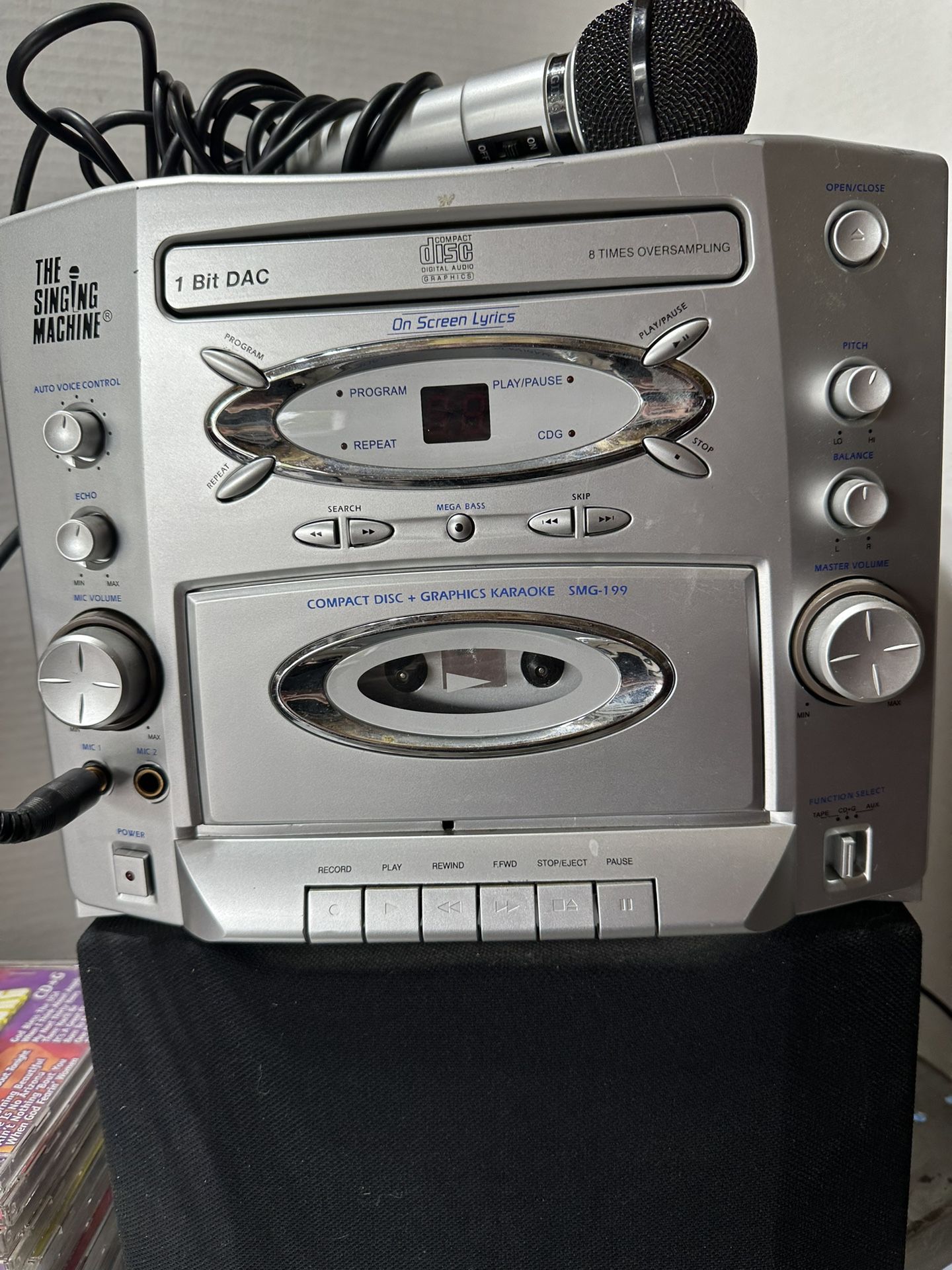 KARAOKE  MACHINE WITH MICROPHONE AND CDS