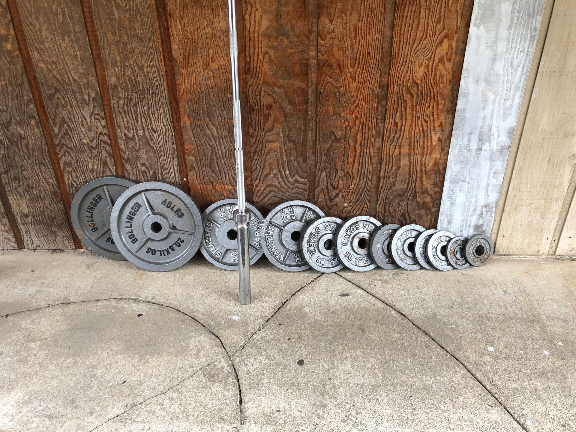 Olympic weights and 7 ft 45 lb bar with collars 45s 35s 25s 10s 5s 2.5s Barbell $60 includes collars Olympic weight set $180 Both together $220 pric