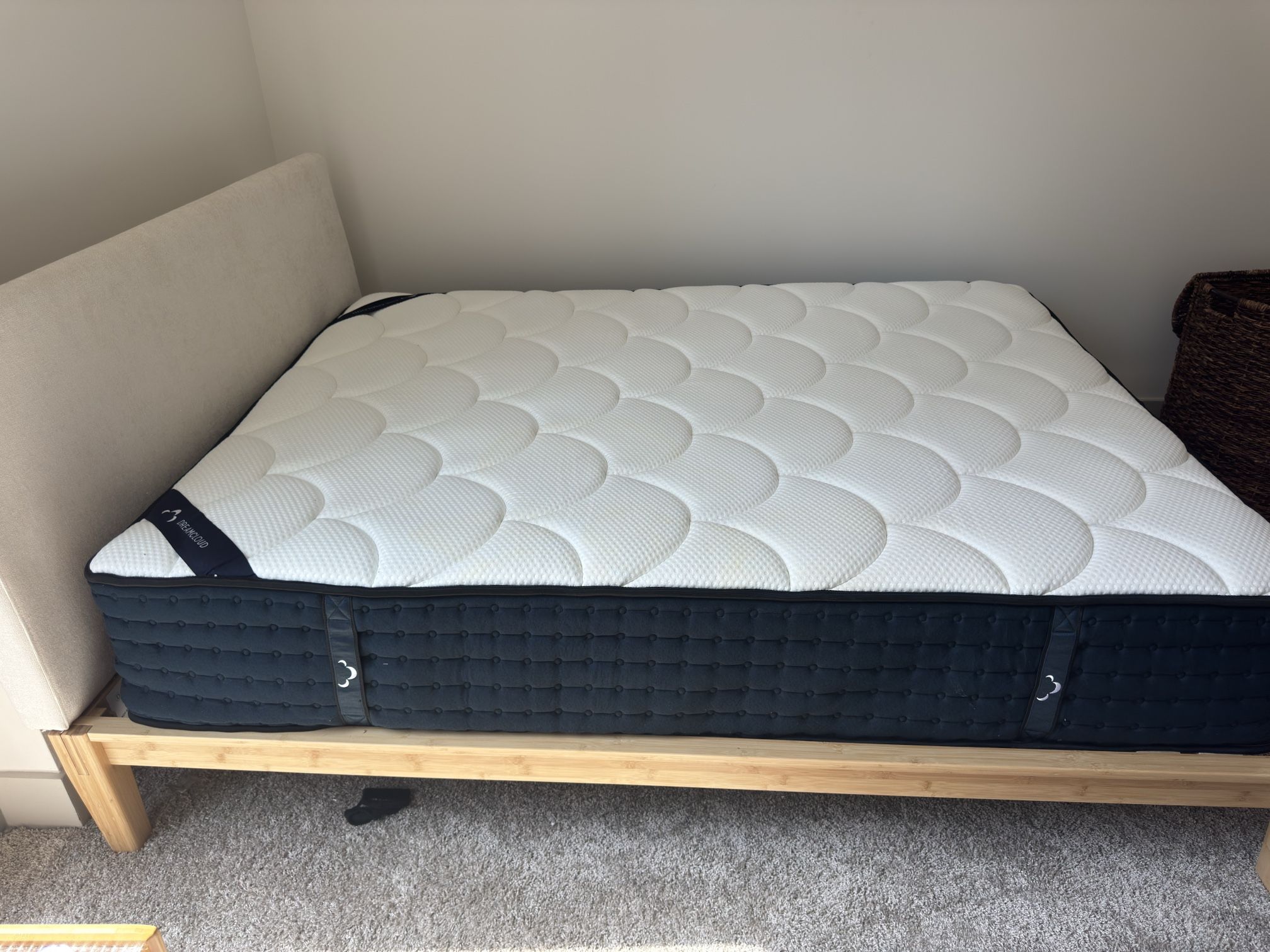 Queen mattress with bamboo bedframe and upholstered headboard