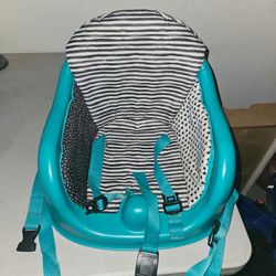 Baby booster with toy rack