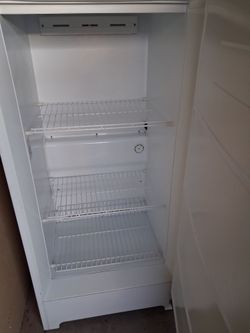 White Westinghouse up right freezer.