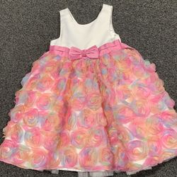 American Princess girls size 4 rainbow-colored special occasion dress with white sleeveless bodice, a pink satin sash with a matching pink bow, and a 