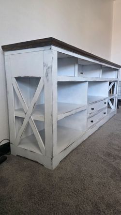 Both Entertainment center and ottoman/coffee table