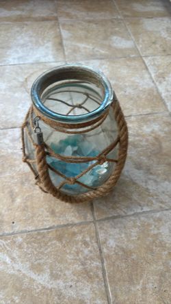 Thick glass jar with sea glass and rope handle