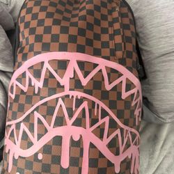 Sprayground Brown Checkered Backpack with Pink Drip Design