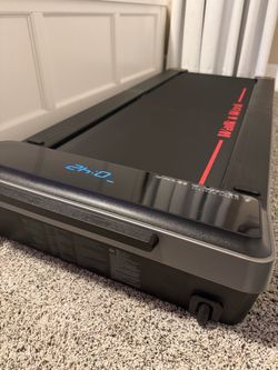 NWB Kingsmith Walk & Work Walking Pad under-desk folding treadmill with red accent lines and branding + remote