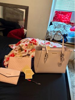 3  beautiful Michael Kors  purses brand new with tags.