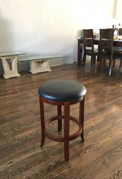 Three bar stools that swivel