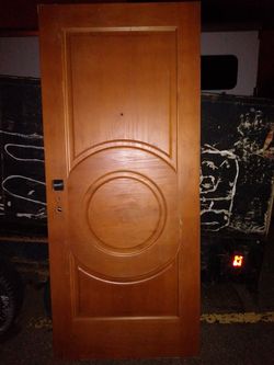 Solid wooden door- plastic sheeting drop lights and carpet remnants