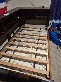 Free twin bed with shelves and trundle