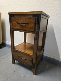Rustic solid wood two-door side table with black accents