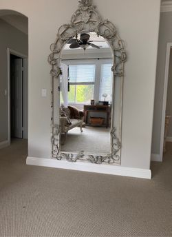 Huge iron wall mirror.