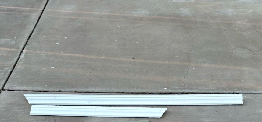2 Pieces of 3 1/2' thick white crown molding, 67" and 40" long.