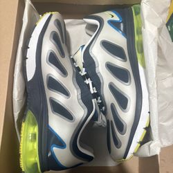 Nike Air Max 96+ Evolve sneakers in a silver, black, and green (or neon yellow) colorway