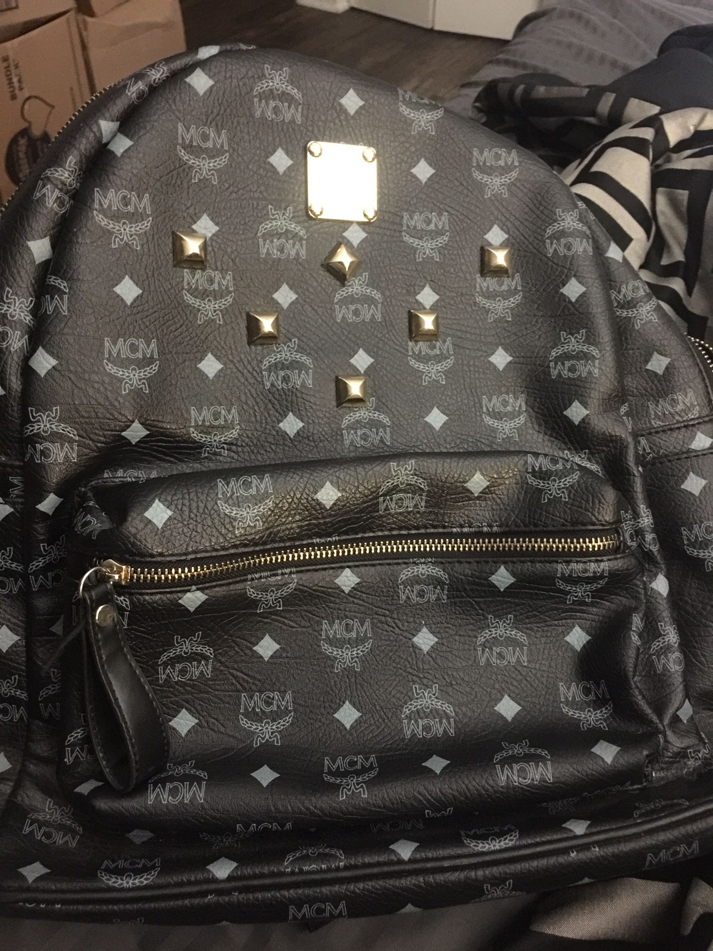 Black and gold MCM backpack alike brand new