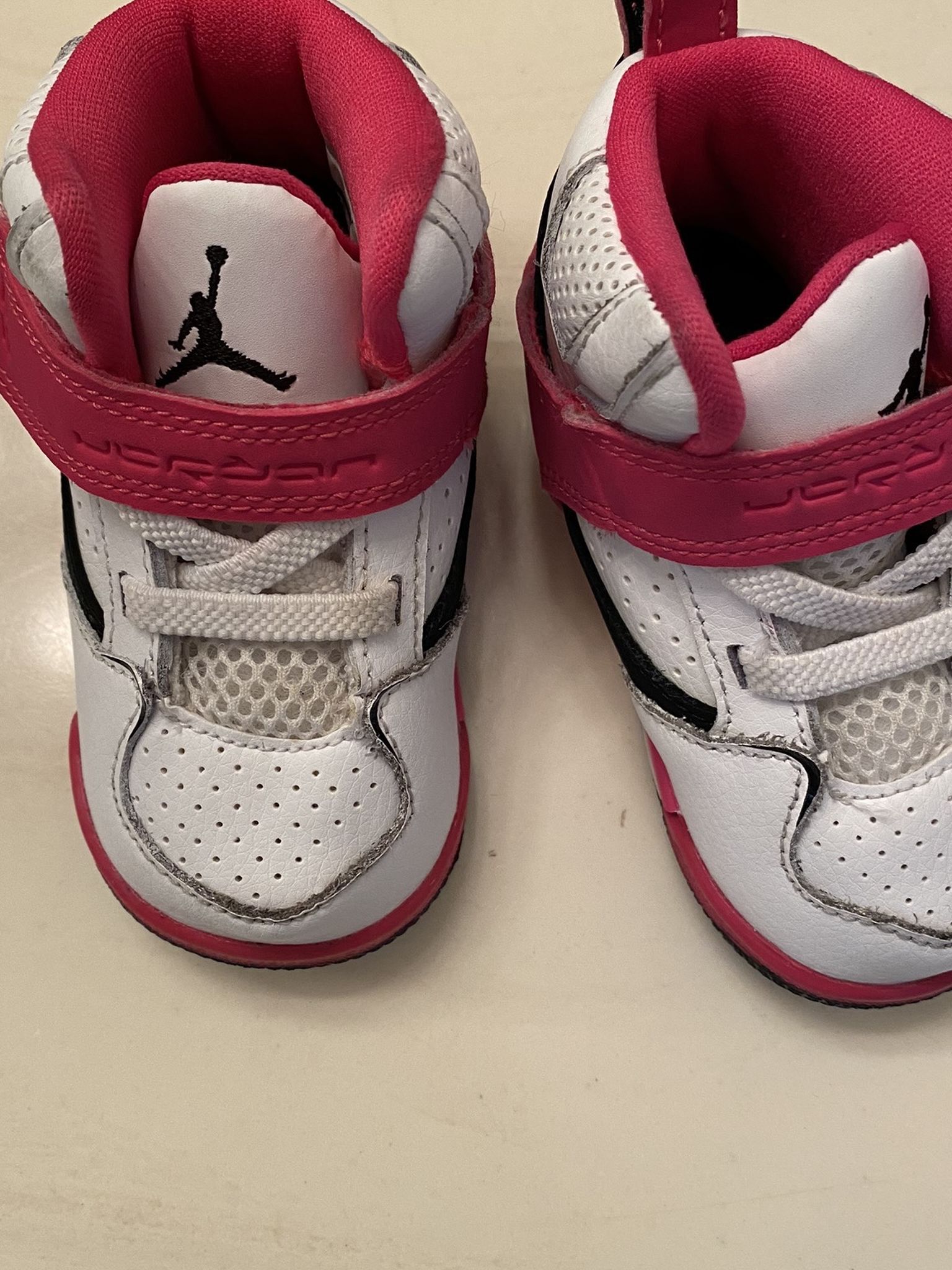 Used infant size 4C pink, white and black Jordans