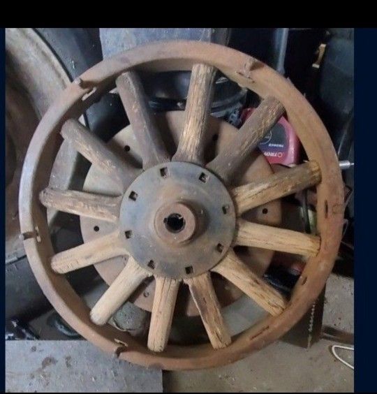 A set of 2 102 Year Old used 12 Wooden spoke dodge wheels