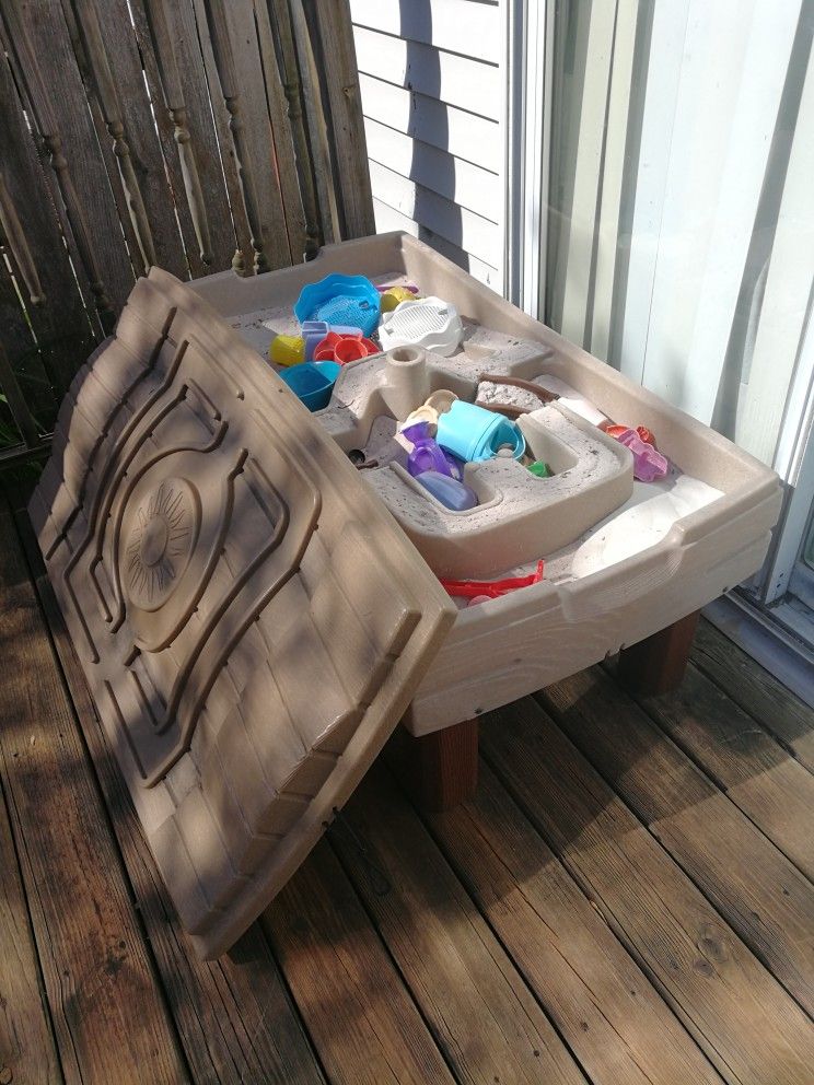 Sand box, perfect for kids,hours and hours of play. It Has A Umbrella Hole In The Middle. Very Good Quality. My Kids Outgrew It.