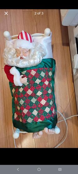 Vintage sleeping Santa in bed
