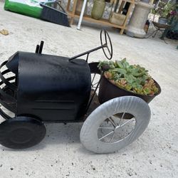 Small Tractor With Plant Base 