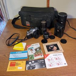 Canon AE-1 Kit with manuals, lenses, case, Flash.  F